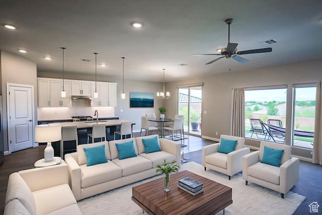 621 N Sage Hen Dr, Washington, UT 84780 - living room with a ceiling fan, recessed lighting, light wood-style floors, and a chandelier