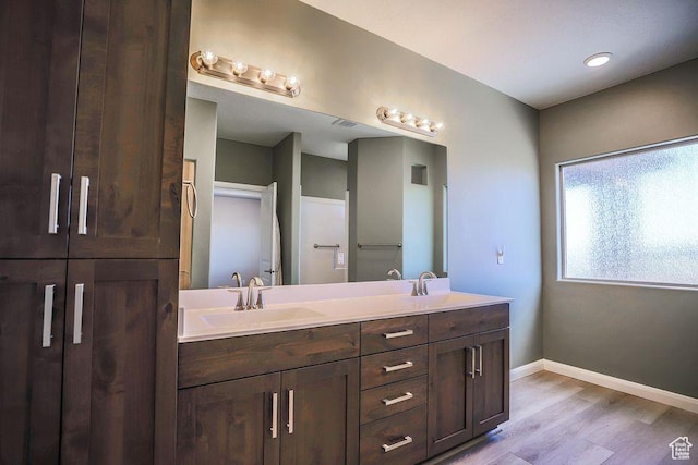621 N Sage Hen Dr, Washington, UT 84780 - bathroom with double vanity and wood finished floors