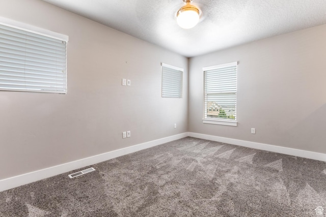 4567 W Breezy Meadow Dr, Herriman, UT 84096 - carpeted spare room with baseboards and a textured ceiling