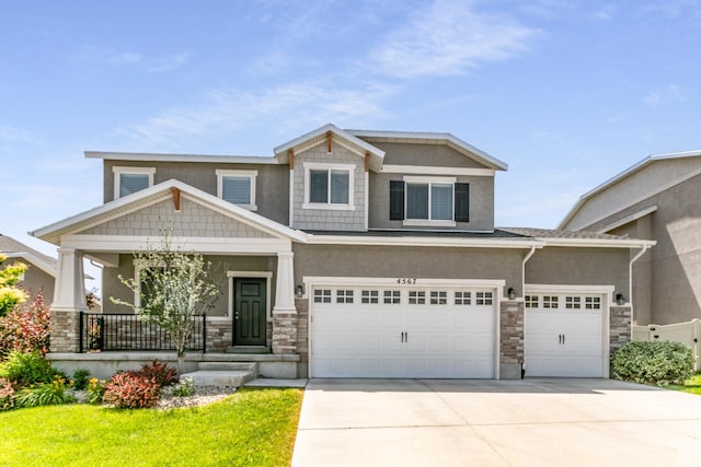 4567 W Breezy Meadow Dr, Herriman, UT 84096 - craftsman house featuring stone siding, driveway, a porch, and stucco siding