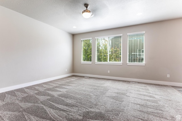 4567 W Breezy Meadow Dr, Herriman, UT 84096 - carpeted spare room featuring baseboards and a textured ceiling
