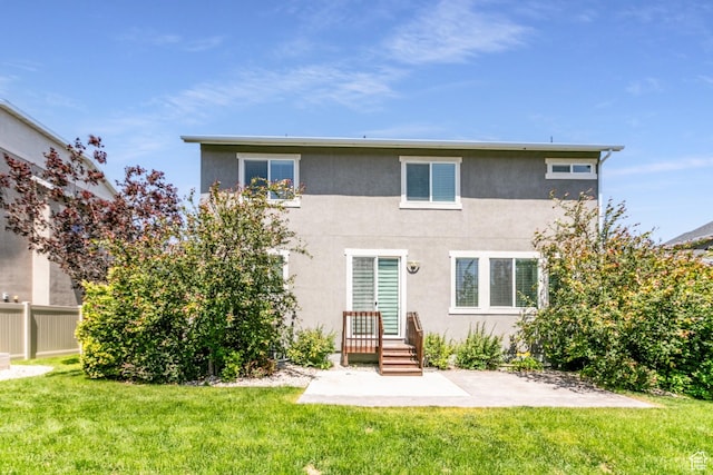 4567 W Breezy Meadow Dr, Herriman, UT 84096 - back of property with stucco siding and a patio area