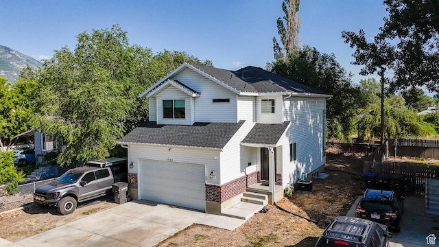 1065 W 200 N, Provo, UT 84601 - traditional-style house with a garage, a shingled roof, and driveway