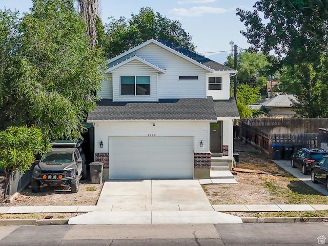 1065 W 200 N, Provo, UT 84601 - view of front of property with a garage, brick siding, and concrete driveway