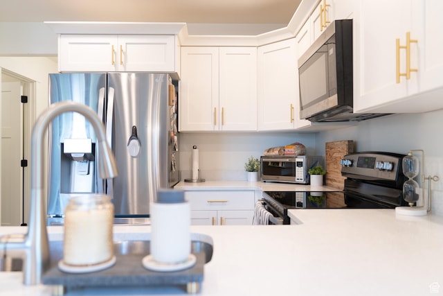 1065 W 200 N, Provo, UT 84601 - kitchen with appliances with stainless steel finishes, light countertops, and white cabinetry