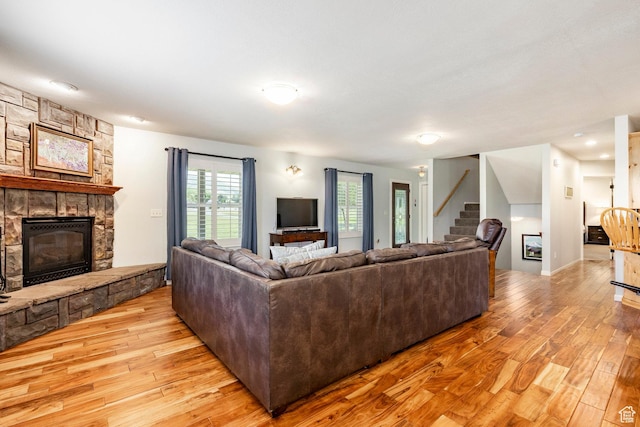 8871 S 100 E, Paradise, UT 84328 - living area featuring a fireplace, light wood finished floors, and stairway
