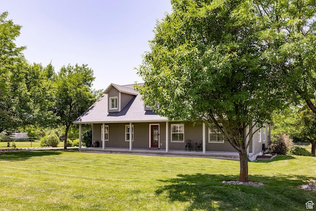 8871 S 100 E, Paradise, UT 84328 - back of property with a lawn, covered porch, and roof with shingles