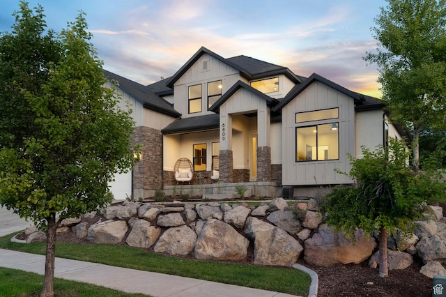 6809 W Vista Springs Dr, Herriman, UT 84096 - view of front facade featuring stone siding and board and batten siding