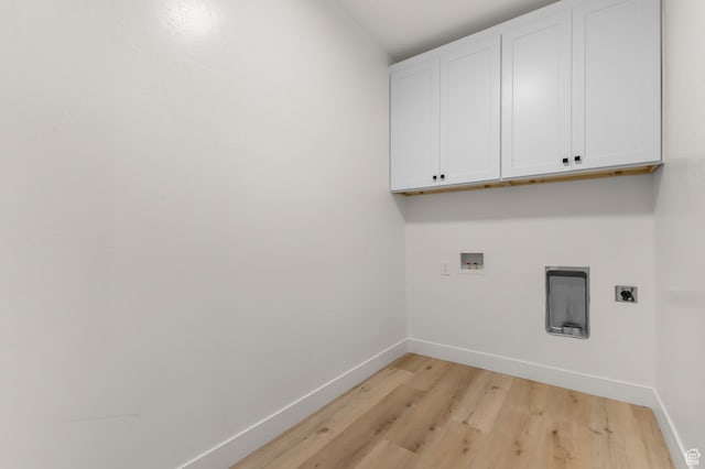 6809 W Vista Springs Dr, Herriman, UT 84096 - washroom with cabinet space, electric dryer hookup, light wood-style floors, and hookup for a washing machine