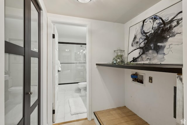 123 E 2nd Ave Unit 505, Salt Lake City, UT 84103 - laundry area featuring marble finish floors and washer hookup