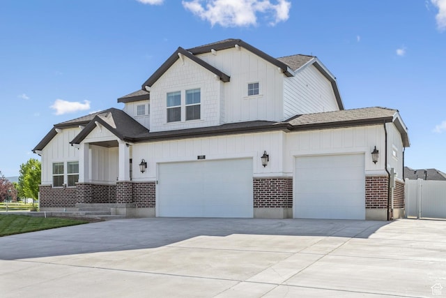 319 S 300 E, Midway, UT 84049 - view of front of house with board and batten siding, brick siding, driveway, a garage, and a shingled roof