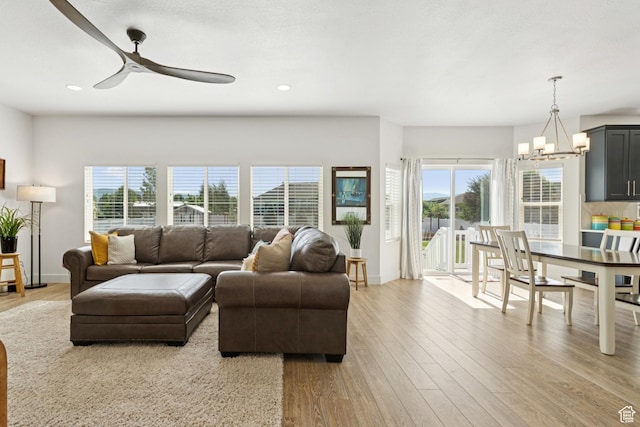 319 S 300 E, Midway, UT 84049 - living room featuring ceiling fan, healthy amount of natural light, light wood-style flooring, a chandelier, and recessed lighting