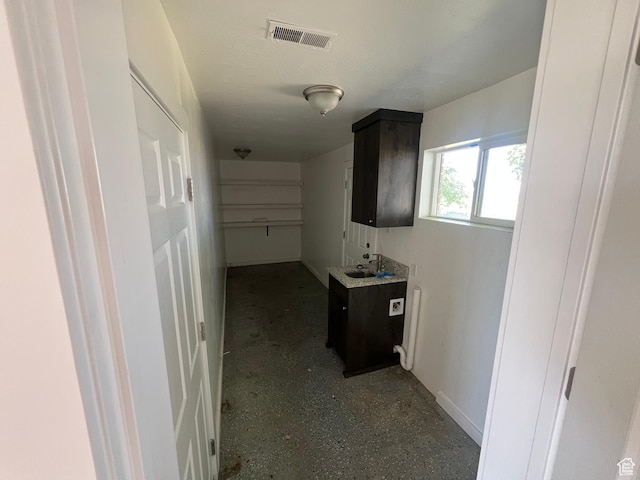 2955 N 7600 W, Corinne, UT 84307 - hallway featuring baseboards and a sink