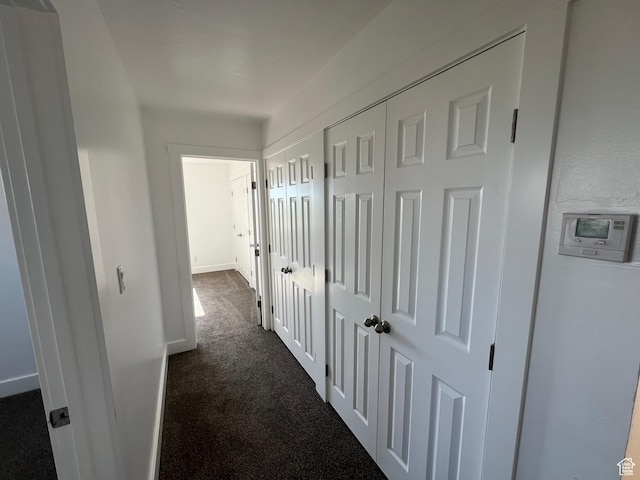 2955 N 7600 W, Corinne, UT 84307 - corridor featuring dark carpet and baseboards