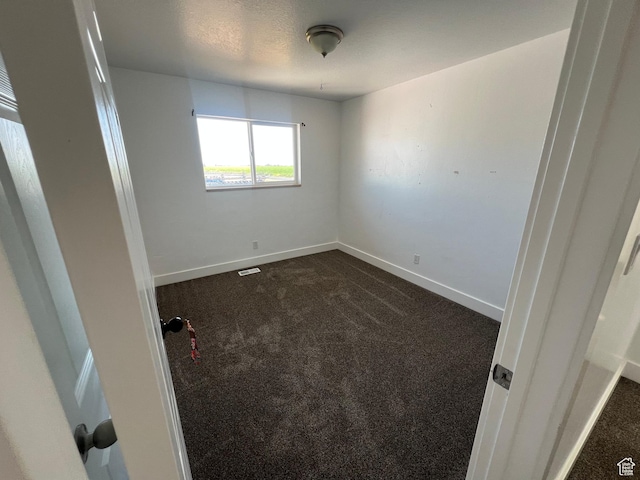 2955 N 7600 W, Corinne, UT 84307 - unfurnished room featuring dark carpet and baseboards