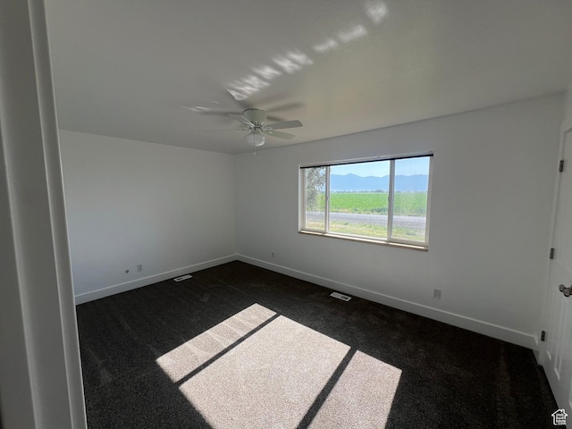 2955 N 7600 W, Corinne, UT 84307 - unfurnished room featuring dark colored carpet and a ceiling fan