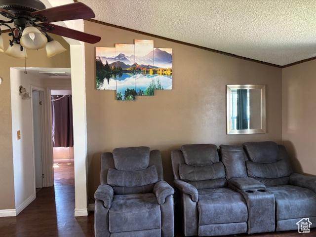 290 E 800 S, Roosevelt, UT 84066 - living area featuring vaulted ceiling, ceiling fan, crown molding, a textured ceiling, and dark wood-style flooring