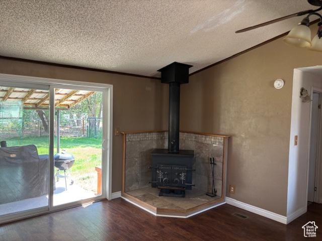 290 E 800 S, Roosevelt, UT 84066 - detailed view of a textured ceiling, wood finished floors, a wood stove, and ceiling fan