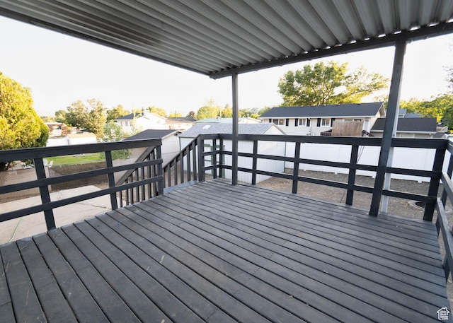9446 S Barium St E, Sandy, UT 84094 - wooden terrace featuring a fenced backyard, a residential view, and a storage shed