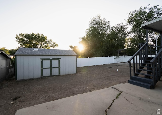 9446 S Barium St E, Sandy, UT 84094 - fenced backyard featuring a storage shed and stairway