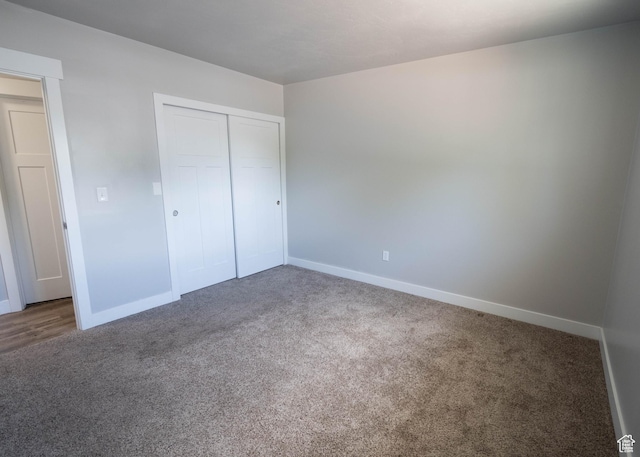 9446 S Barium St E, Sandy, UT 84094 - unfurnished bedroom featuring carpet and a closet
