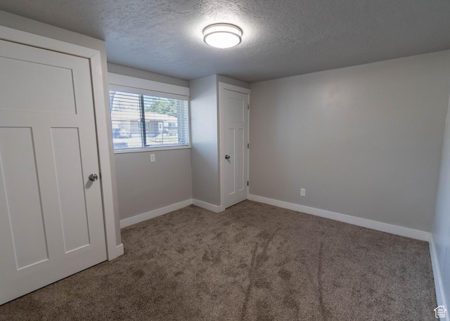 9446 S Barium St E, Sandy, UT 84094 - unfurnished bedroom with a textured ceiling and carpet flooring