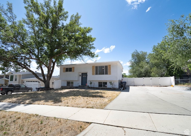 9446 S Barium St E, Sandy, UT 84094 - split foyer home featuring a gate