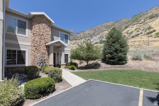 1183 N Canyon Meadow Dr E Unit 9, Provo, UT 84606 - property entrance featuring stone siding, stucco siding, and a mountain view