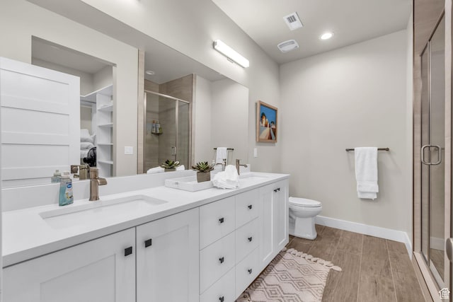 864 W Eland Cir, Heber City, UT 84032 - full bath featuring double vanity, a stall shower, wood finished floors, and a spacious closet