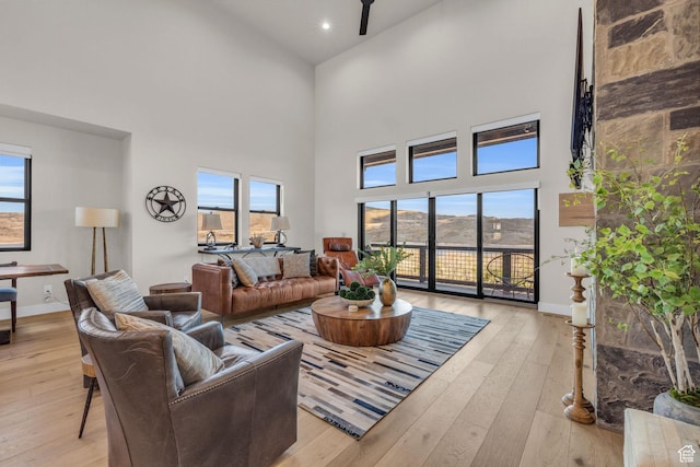 864 W Eland Cir, Heber City, UT 84032 - living area featuring a towering ceiling, light wood finished floors, and recessed lighting