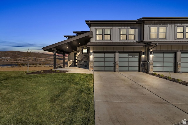 864 W Eland Cir, Heber City, UT 84032 - multi unit property with board and batten siding, an attached garage, concrete driveway, a front yard, and stone siding