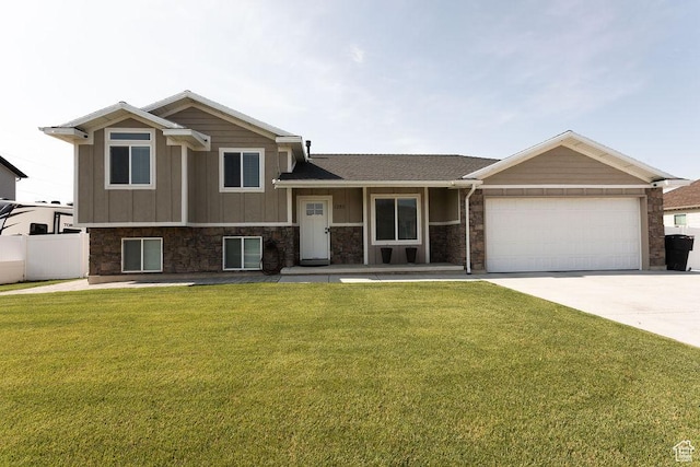 1285 W 1100 N, Farr West, UT 84404 - split level home with a garage, driveway, and board and batten siding