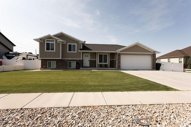1285 W 1100 N, Farr West, UT 84404 - tri-level home featuring concrete driveway, a garage, brick siding, and a gate