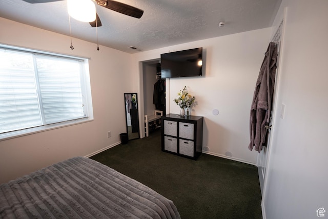 2087 E Weeping Willow Way N, Eagle Mountain, UT 84005 - bedroom with dark colored carpet, a textured ceiling, and ceiling fan