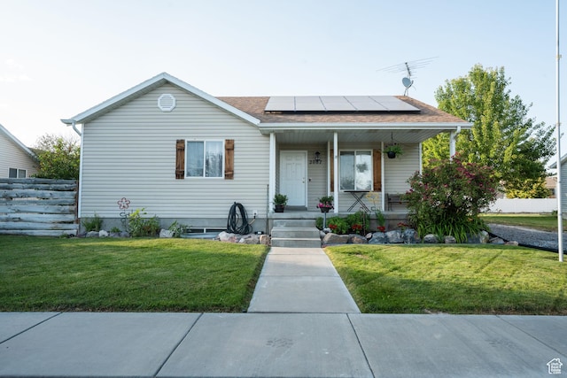 2087 E Weeping Willow Way N, Eagle Mountain, UT 84005 - bungalow with covered porch, roof mounted solar panels, and roof with shingles