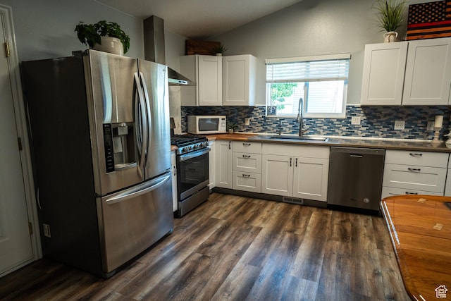 2087 E Weeping Willow Way N, Eagle Mountain, UT 84005 - kitchen with stainless steel appliances, vaulted ceiling, backsplash, dark wood-style floors, and white cabinetry