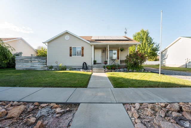 2087 E Weeping Willow Way N, Eagle Mountain, UT 84005 - view of front of home with roof mounted solar panels and a porch