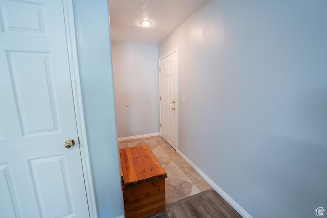 2087 E Weeping Willow Way N, Eagle Mountain, UT 84005 - hallway featuring baseboards and a textured ceiling