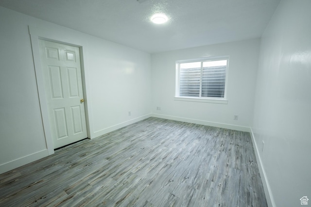 2087 E Weeping Willow Way N, Eagle Mountain, UT 84005 - empty room with wood finished floors