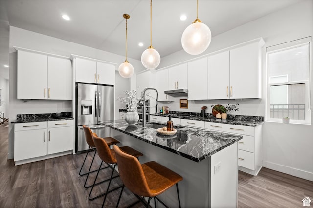4753 W Mossley Dr, Herriman, UT 84096 - kitchen featuring stainless steel fridge with ice dispenser, dark wood-style floors, decorative light fixtures, white cabinets, and recessed lighting