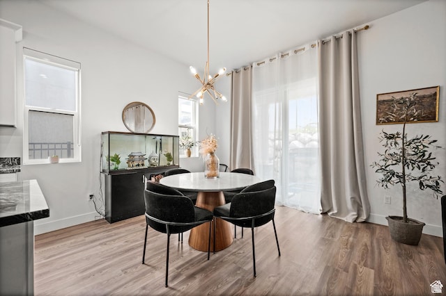 4753 W Mossley Dr, Herriman, UT 84096 - dining area with wood finished floors and a chandelier