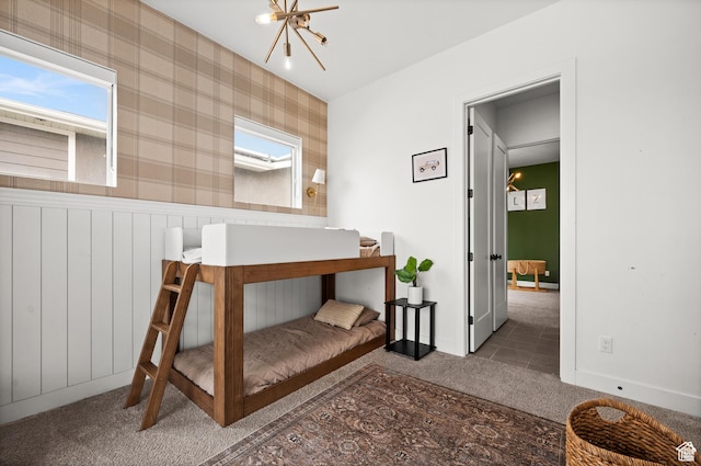 4753 W Mossley Dr, Herriman, UT 84096 - bedroom with carpet flooring, a chandelier, and wainscoting