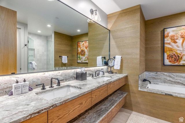 7615 E Stardust Ct Unit 319H, Heber City, UT 84032 - bathroom featuring double vanity, a bath, tile patterned floors, tile walls, and recessed lighting