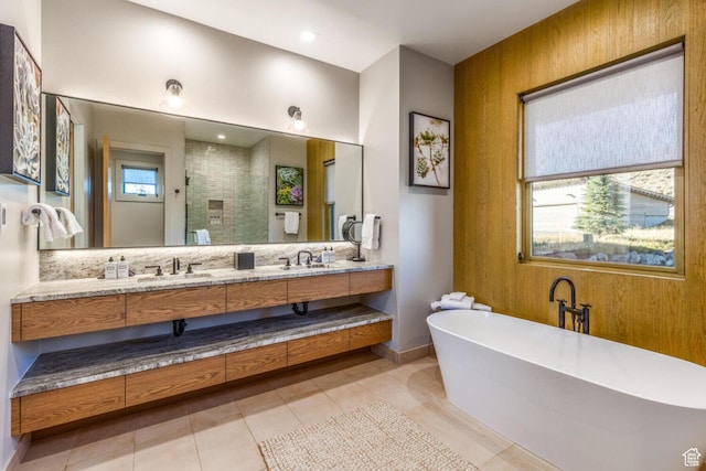7615 E Stardust Ct Unit 319H, Heber City, UT 84032 - bathroom featuring double vanity, a soaking tub, a tile shower, tile patterned flooring, and backsplash
