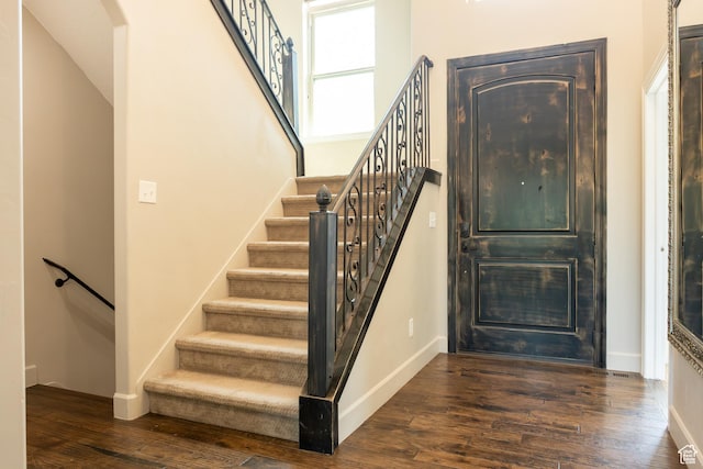 12768 S Whisper Bend Dr E, Draper, UT 84020 - stairway with wood finished floors and arched walkways