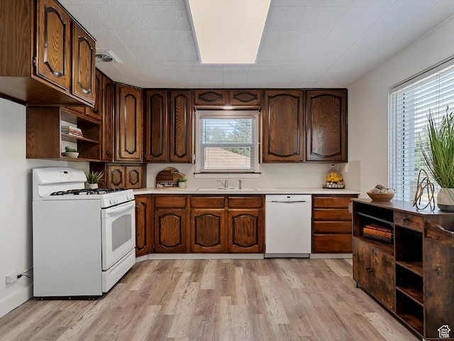 1425 E 22nd St S, Ogden, UT 84401 - kitchen with white appliances, open shelves, light wood-type flooring, and light countertops