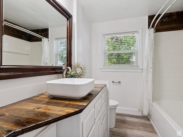 1425 E 22nd St S, Ogden, UT 84401 - bathroom featuring vanity, wood finished floors, and shower / tub combo