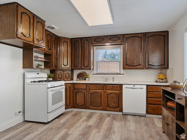 1425 E 22nd St S, Ogden, UT 84401 - kitchen with white appliances, open shelves, light wood finished floors, and light countertops