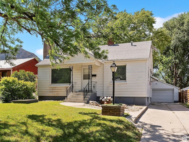1425 E 22nd St S, Ogden, UT 84401 - bungalow-style house featuring a chimney, an outbuilding, a front yard, a garage, and roof with shingles