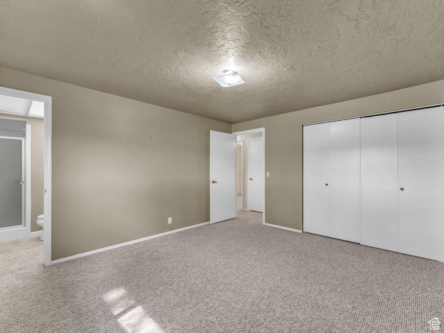 12580 S Janice Dr, Riverton, UT 84065 - unfurnished bedroom featuring a textured ceiling, carpet, and a closet